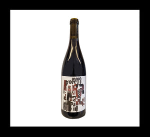 Burgundy-style bottle with the Wine Snob* 2020 Pinot Noir label featuring artwork by Laurie Szujewska. The artwork is a collage of letters and numbers in shades of brown, grey, and black, with a white background.