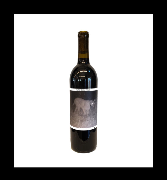 Bordeaux-style bottle with the Wine Snob* 2020 Puma-1 label showing a black-and-white photo of Puma-1, a mountain lion.