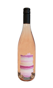 Burgundy-style bottle with the Wine Snob* 2023 Rhôsé label that is an outline of an owl filled in with varying shades of pink.
