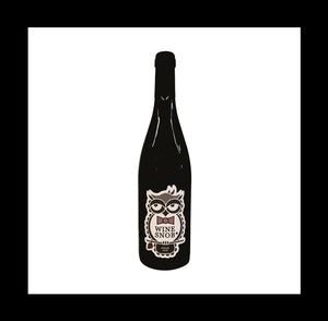 Burgundy-style bottle with the Wine Snob* 2018 Syrah label showing an owl perched on a stick with a leaf, slightly rolling its eyes, and wearing a purple bowtie with white polka dots.
